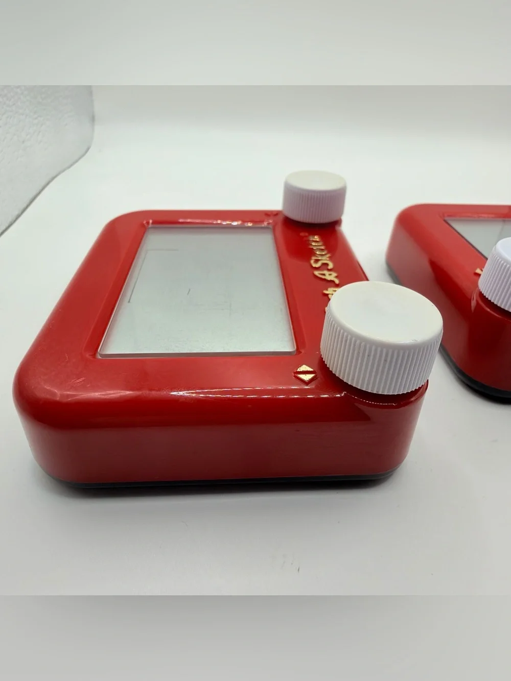 Pair of Mini Classic Red etch a Sketch toys